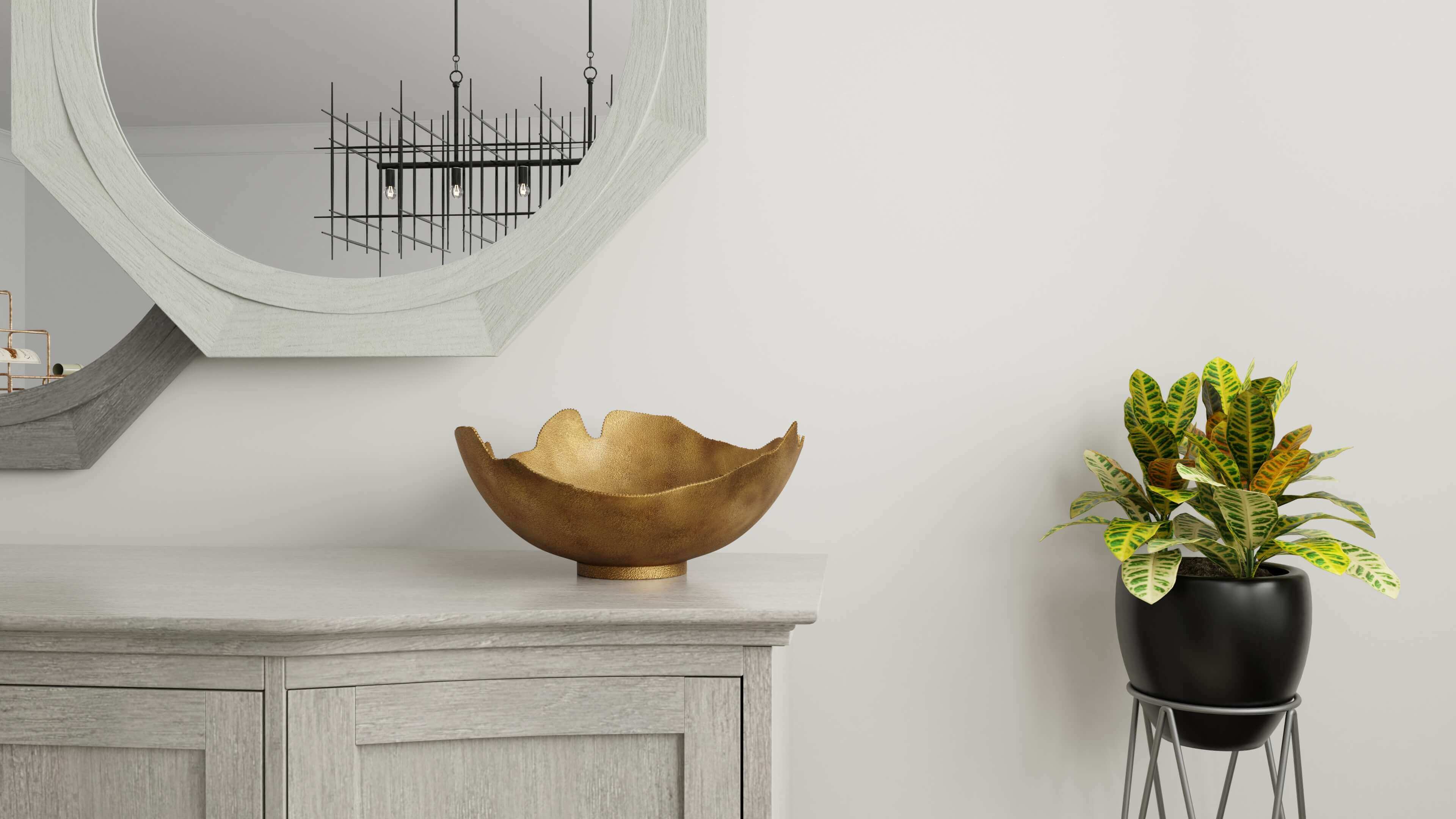 3D rendering of gold bowel, mirror, cabinet and potted plant in white room