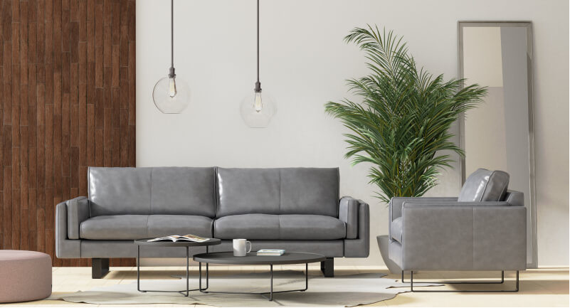 3D grey leather sofa and chair with large green plant and round hanging lights made in imagine.io