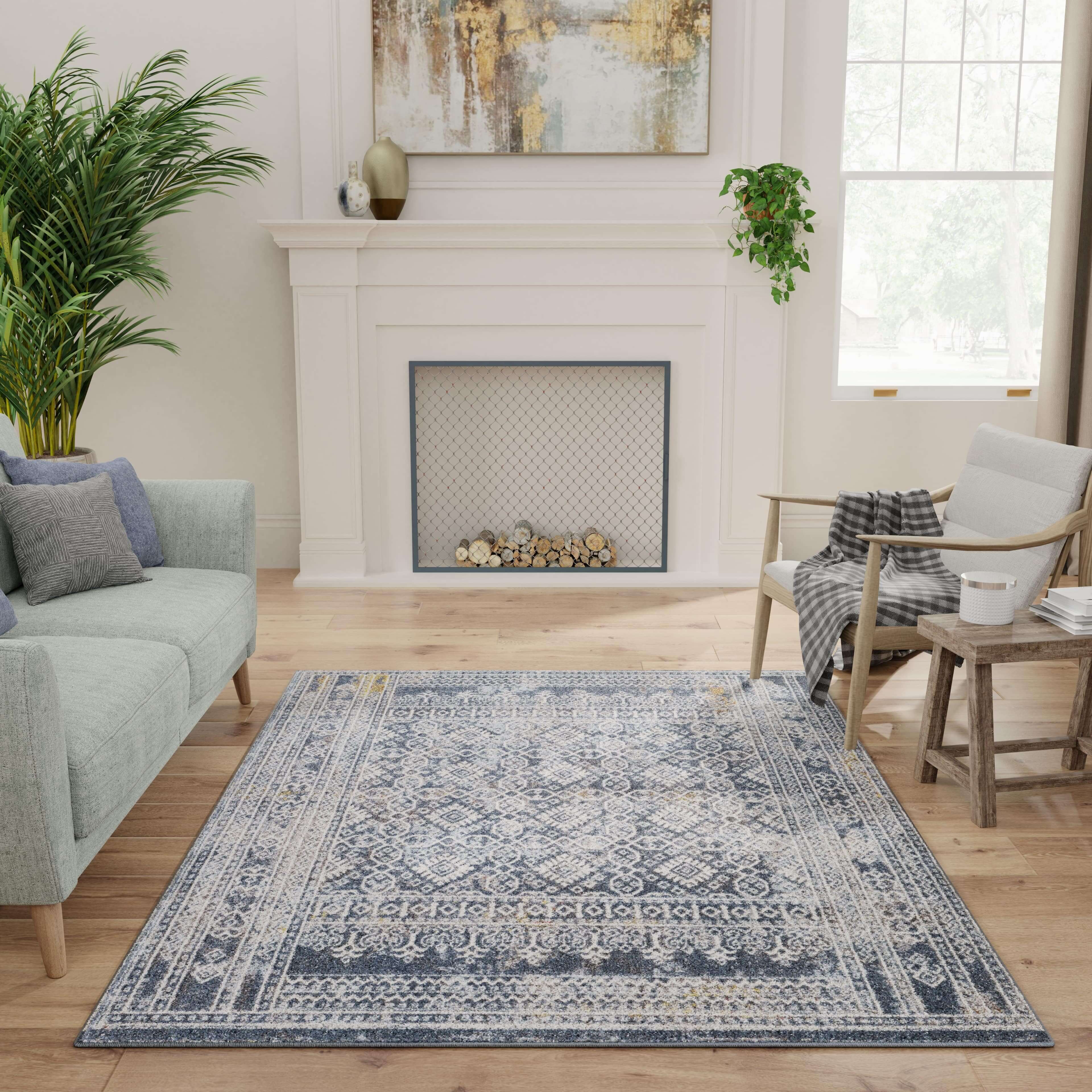 Blue oriental style Natco rug by fireplace on 3D living room template created with imagine.io