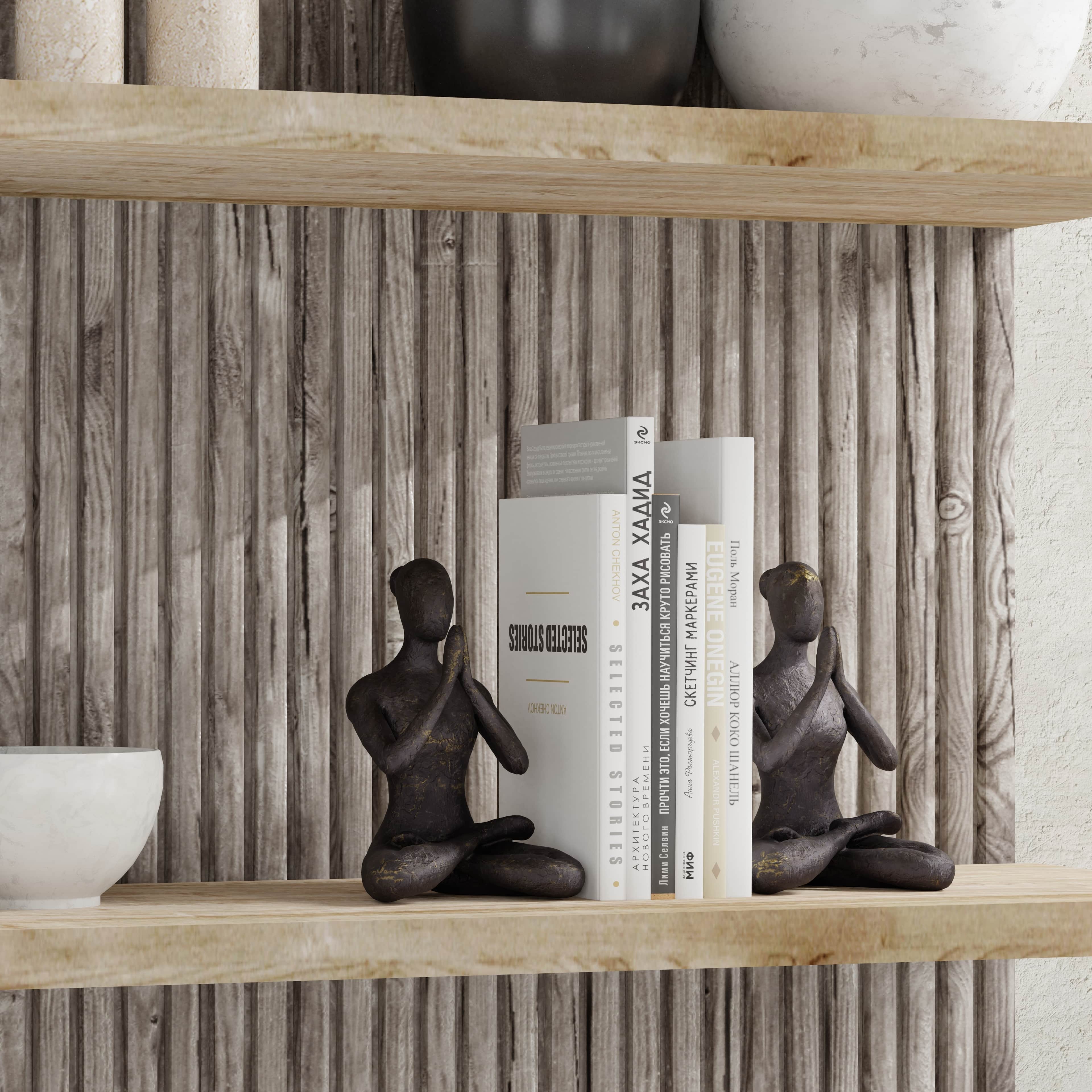 3D praying brass bookends on wooden shelf made with imagine.io